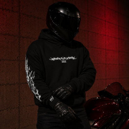 Front view of the black Classic Reflective Hoodie with 444 chest graphic